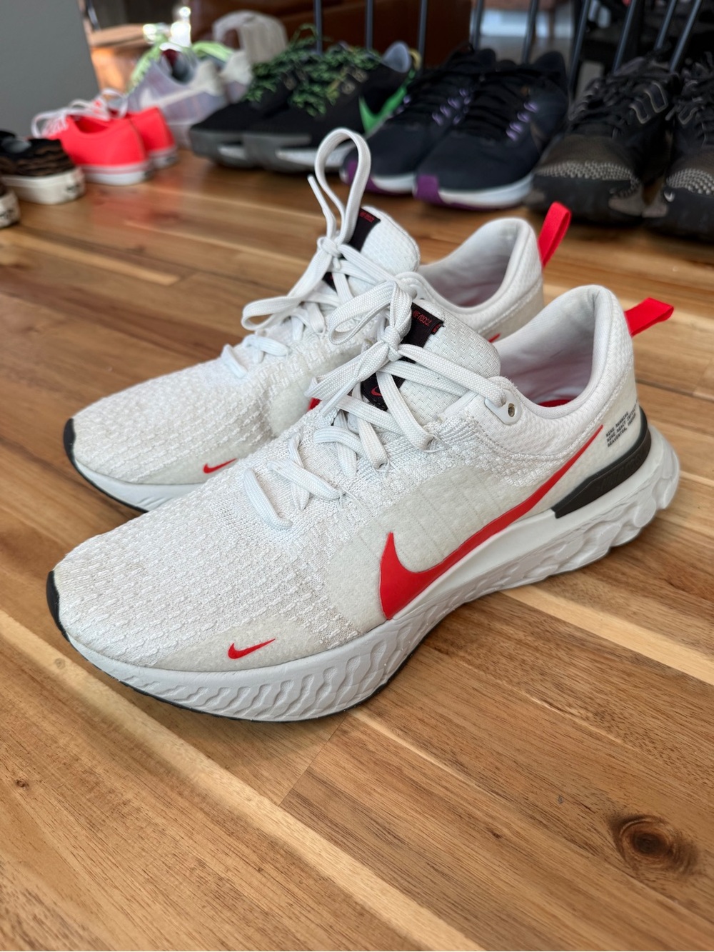 Nike Kids White Sneakers with Red Swoosh